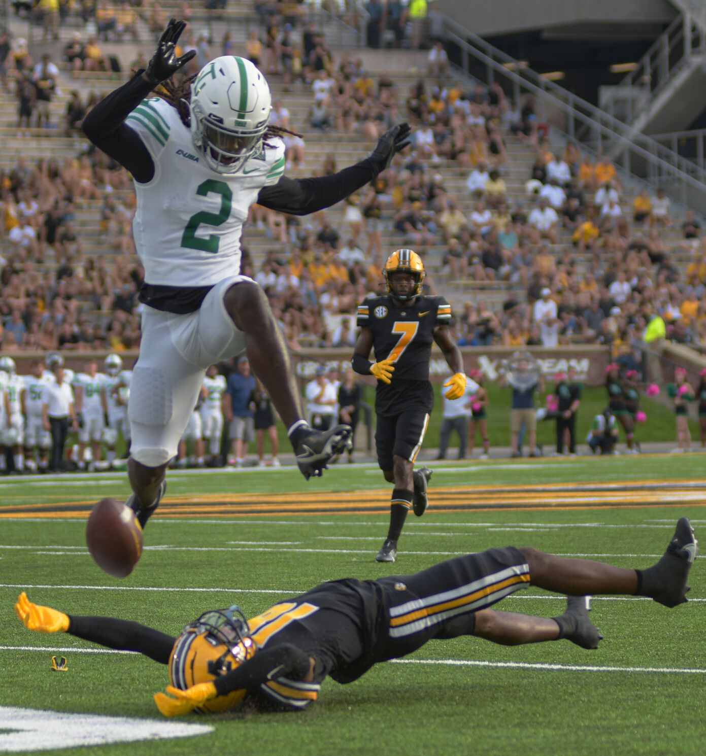 Deshawn Gaddie jumps over Chance Luper